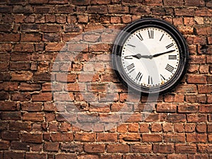 Station Clock On A Red Brick Wall
