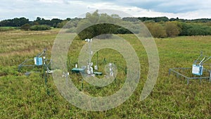 Station science research for studying wetlands meadows, drone aerial video shot ecosystem weather station swamp willows