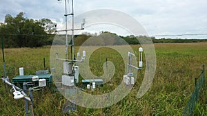 Station science research for studying wetlands meadows, drone aerial video shot ecosystem weather station swamp willows