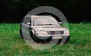 Station Wagon Family Car Parking In the Grass at the Forest, Spring Advanture