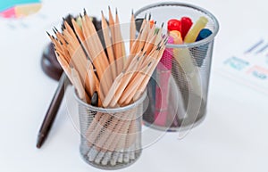 stationaries with color pan and pencils on office table