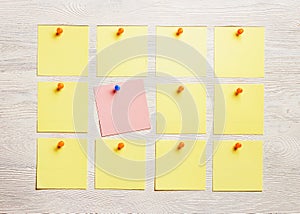 Stationary, Blank Colored Sticker Pined on White Wooden Board. Top View. Flat Lay. Time-management, Planning.