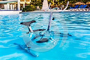 Stationary exercise bike in a swimming pool,