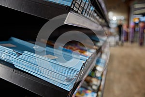 Stationary shop rack with paper copy-books assortment selective focus