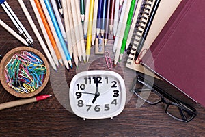 Stationery around white clock