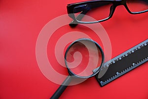 Stationery items close-up on a red background
