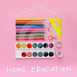 Stationery on a pink background, stationery in the form of a house on top