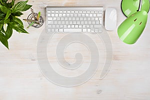 Stationery sapplies, lamp, computer keyboard and mouse on office table