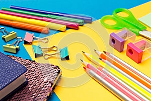 Stationery. School and office supplies on a colored background. Selective focus