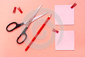 Stationery - sheets for notes clipped, pencil and scissors on a