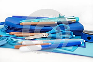 Stationery stack . Back to school. Paper sheets notepad pencils multicolor pen sharpener pencil case scissors . Frame