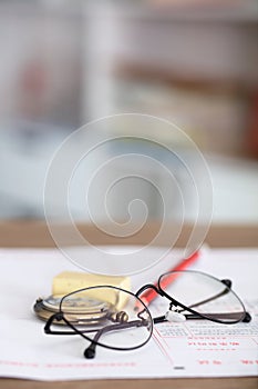 Stationery such as glasses and pencils on the test answer sheet