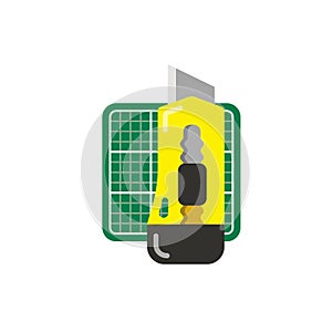 Stationery yellow knife and green cutting mat.