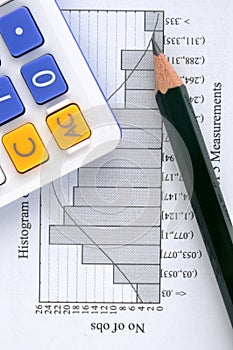 Statistic graph, pencil and calculator
