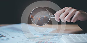 statistical analyst using calculator to calculate and read reports, graphs and charts, business statistics ,Analysis and