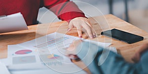 statistical analyst using calculator to calculate and read reports, graphs and charts, business statistics ,Analysis and