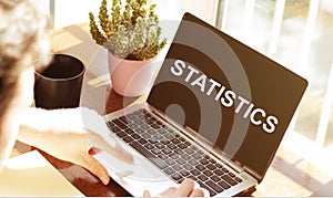 Statistics word on the laptop Social Networking Technology Innovation Concept