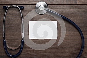 Statoscope and blank notebook on wooden table