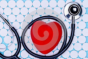 Statoscope stylish doctor with a heart on a white background from pills. Antibiotic resistance.