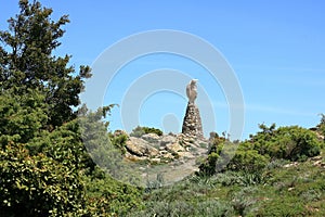 Statua San Michele on top of sardinian mountain landscape near Biddamanna IstrisÃ ili Villagrande Strisaili Arzana, Italy photo