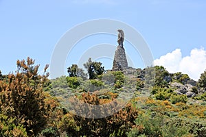 Statua San Michele on top of sardinian mountain landscape near Biddamanna Istrisàili Villagrande Strisaili Arzana, Italy