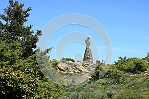 Statua San Michele on top of sardinian mountain landscape near Biddamanna Istrisàili Villagrande Strisaili Arzana, Italy