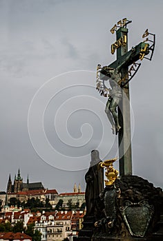 Statuary of St. Cross , Calvary , in Charles bridge, Prague.Czech Republic.