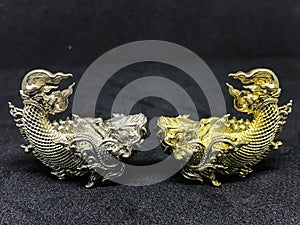 Statuary striped Thailand golden and silver fish