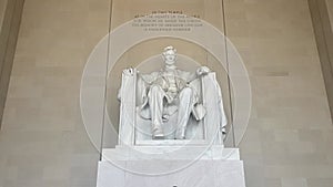 The statue of Abraham Lincoln sitting in a chair at the National Mall Memorial in Washington DC (USA).