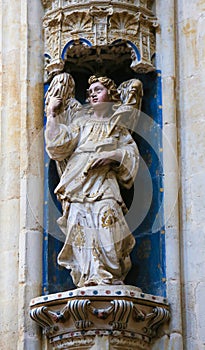 Statue of an angel in Convento de San Esteban, Salamanca photo