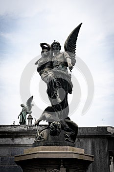 Statue of an angel defeating a demon