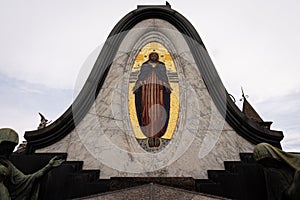 Statue of an angel defeating a demon