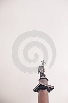 Statue of an angel holding a cross