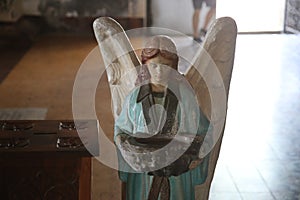 Statue of an angel inside a Church photo