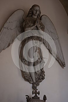 Statue of angels at the Staglieno cemetery in Genoa photo