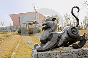 Statue of animal from ancient Chinese myth on sunny spring day