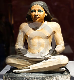 Statue of an anonymous seated Scribe. The Egyptian Museum in Cairo