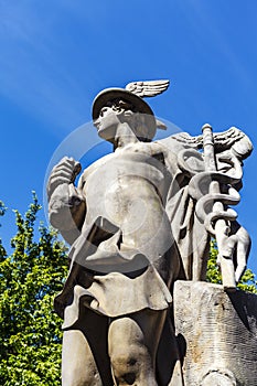 Statue of the antique god of commerce, merchants and travelers Hermes Mercury at Borsen stock exchange in Copenhagen, Denmark