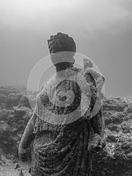 Statue of Antonia Minor in Claudioâ€™s Ninfeum. underwater, archeology.
