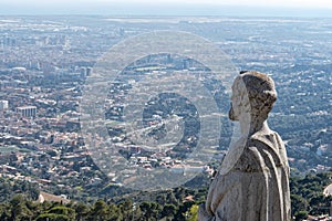 Statue of apostle observing on city Barcelona on Temple Sacred Heart of Jesus on Mount Tibidabo