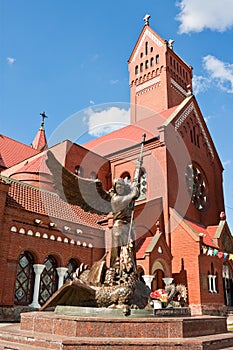 Statue of Archangel Michael and the Catholic Church of St. Simon