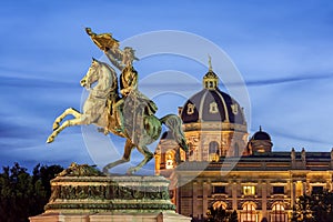 Statue of Archduke Charles and Museum of Natural History dome at sunset, Vienna, Austria