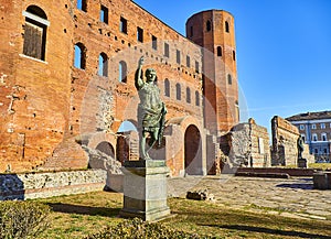 Statue of Augustus Caesar at Porta Palatina Gate. Piazza Cesare Augusto square. Turin, Piedmont, Italy photo