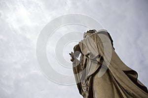 A statue of Avalokitesvara stands in the distance