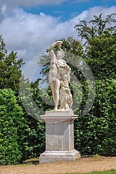Statue of Bacchus with grape in the Gardens of Versailles