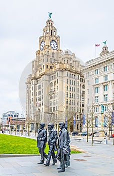 Statue of the Beatles in front of the royal liver building in Liverpool, England