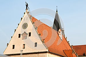 Statue of belfry bell ringer on the roof