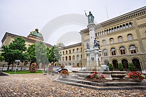 Statue of Berna Bernabrunen, a personification of the city of Bern, by Raphael Christen 1858 in front of the Bundeshaus West