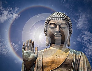 The statue of Big Buddha face with hand in Hongkong