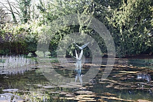 A statue of birds flying in the grounds of Le Manoir aux Quat Saisons in Oxfordshire in the UK